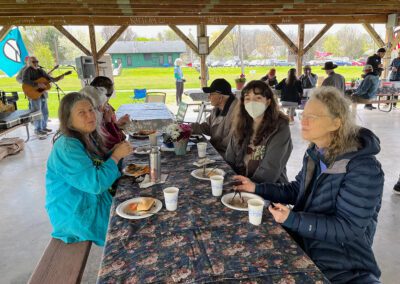 Group enjoying meal in outdoor pavilion